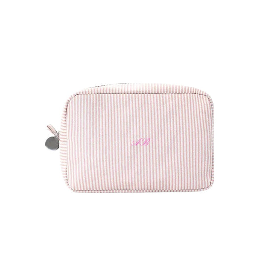 Pink striped pouch with initials on a white background